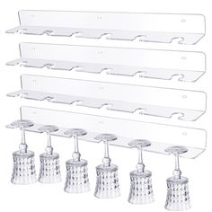 six glass shelfs with metal handles and knobs