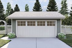 a two car garage in front of a white picket fence