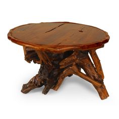 a round wooden table made out of logs