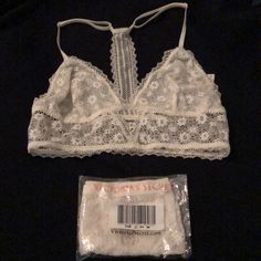 Nwt Victoria’s Secret Bralette And Panty Bundle! Bralette Is In Great Condition And Only Worn A Few Times. It Has A Place For Padding To Be Inserted But Does Not Come With It. Panties Are Unopened (Ordered Online) But The Photo At The End Shows Bikini Style. They Are The Same Ivory Color But They Didn’t Come As A Matching Set. Please Ask If You Have Questions! White Bra For Spring Loungewear, White Spring Loungewear Bra, Spring White Loungewear Bra, White Stretch Lace Bra, White Lace Stretch Bra, White Stretch Bra With Lace Trim, Victory Secret, Ivory Color, White Cream