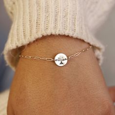 Sterling silver Tree of Life Hand stamped personalized disc bracelet with a sterling silver chain is uniquely hand crafted for you in Melt'm Jewelry Studio in Redlands, California. Handmade from high-quality Sterling Silver. This bracelet features a cute custom disc that hand stamped with a tree of life. It makes a thoughtful and heartfelt gift for moms, grandmothers, sisters, friends, and more. * Sterling silver disc is 9.5mm diameter. * Tree of Life stamped by hand. * Smooth finish, hammered o Dainty Customizable Silver Bracelet, Meaningful Sterling Silver Friendship Bracelets, Sterling Silver Round Jewelry For Friendship, Sterling Silver Round Bracelets For Gifts, Customizable Round Jewelry For Friendship, Adjustable Sterling Silver Bracelet As A Gift, Adjustable Sterling Silver Round Bracelet As A Gift, Adjustable Round Sterling Silver Bracelet As Gift, Adjustable Round Sterling Silver Bracelet For Gifts