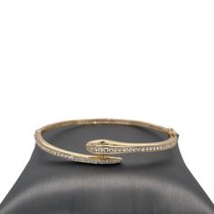 "𝓦𝓮𝓵𝓬𝓸𝓶𝓮 𝓽𝓸 𝓛𝓲𝓸𝓷𝓱𝓮𝓪𝓻𝓽 𝓳𝓮𝔀𝓮𝓵𝓻𝔂 𝓢𝓱𝓸𝓹 ♥ Our beautiful, Diamond Wrapped Snake Bangle crafted in 14K Yellow Gold. This beautiful bangle is crafted with pave set diamond halfway around the bangle and bezel set Tsavorite eyes. The bangle is beautiful on its own and eye catching, or great to stack amongst other bracelets or bangles. Please note the possibility of natural inclusions in gemstones.  *Please check measurements below, items may appear larger on the screen. Inner Gold Bangle Bracelet With Pave Setting As Gift, Gift Gold Bangle Bracelet With Pave Setting, Snake Yellow, Gents Bracelet, Snake Bangle, Gorgeous Necklaces, Beautiful Packaging, Bangle Bracelet, Chain Bracelet