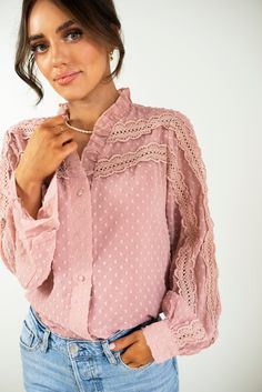 Our Stella Blouse is made with Swiss-dot woven fabrication. It has ruffle detail on the V neckline with a button down front for closure. Lace trim is sewn on top of the front sleeve and is lined inside. Made with 100% Polyester. Available in women's sizes: Small Medium Large Spring Button-up Blouse With Lace Collar, Spring Swiss Dot Long Sleeve Tops, Spring Long Sleeve Swiss Dot Tops, Long Sleeve Swiss Dot Tops For Spring, Chic Swiss Dot Long Sleeve Tops, Chic Polka Dot Blouse With Buttons, Chic Long Sleeve Swiss Dot Tops, Chic Long Sleeve Tops With Swiss Dot, Spring Polka Dot Swiss Dot Blouse