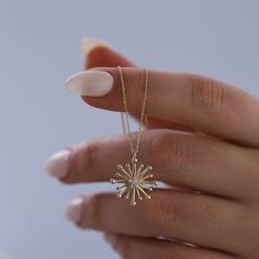 Diamond & 14K Solid Gold Starburst Necklace: This stunning 14K solid gold starburst pendant with your choice of genuine diamond or cubic zirconium stone is a symbol of guidance, protection, inspiration and hope. Bold enough to make a statement on its own, and minimal enough to be layered with other pieces, this necklace will glow brightly and help serve as a reminder that there is meaning and purpose behind every destination.  Materials & Specifications:  - 14K solid gold chain and pendant - Genuine diamond or cubic zirconium stone  - Chain thickness is 2.5mm - Pendant dimensions are 1.6cm x 1.6cm Available in 5 different chain lengths: 42cm (16.5 in), 45cm (17.7 in), 47cm (18.5 in), 49cm (19.3 in) As with all of our products, this item is handmade and made to order. **WEARING YOUR JEWELRY 3 Diamond Pendant, Dainty Starburst Yellow Gold Jewelry, 14k Gold Starburst Jewelry Gift, 14k Gold Starburst Jewelry As Gift, 14k Gold Starburst Jewelry For Gift, Yellow Gold Starburst Necklace As Gift, Yellow Gold Starburst Necklace For Gift, Starburst Fine Jewelry Necklace As Gift, Starburst Fine Jewelry Necklace For Gift