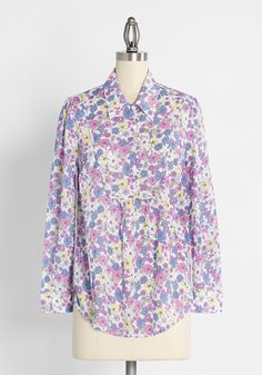 You belong among the wildflowers in this vintage-inspired shirt from our ModCloth namesake label. Made from an airy cotton-blend, this white top is adorned in an exclusive and romantic print of daisies in shades of purple, blue, white, and yellow. Boasting button cuffs, a unique bib front with a point collar, and button-front closure, this breezy retro-chic blouse offers subtle shirring at the yoke seam is truly unique and looks awesome paired with country Western-inspired boots. Cotton. Machine Vintage Style Swimwear, Among The Wildflowers, Designer Plus Size Clothing, Casual Dresses Plus Size, Midi Dress Plus Size, Feminine Blouses, Chic Blouses, Plus Size Outerwear, Flower Patch