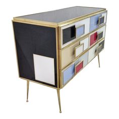 a multicolored chest of drawers with metal legs