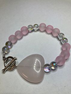 Pink Quartz Heart Glass Beads Measure the circumference of your wrist and add 1/2 inch to get the correct size. Please message me at the checkout, if you would like the item with a gift box (Complimentary) To return to my homepage, click the below: https://www.etsy.com/shop/AllisonsJewels Yellow Flower Necklace, Awesome Crafts, Diy Jewelry Unique, Clear Beads, Heart Stone, Diy Bracelet Designs, Beads Bracelet Design, Classy Wedding, Cute Necklace