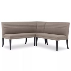 a corner couch with two legs and a back rest