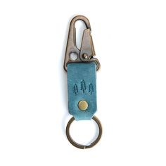 Aqua*Short| leather logo branded keychain Brass Keyring, Aqua Shorts, Portland Leather Goods, Ring Minimal, Leather Hides, Tree Logo, Tree Logos, Leather Hide, Handcrafted Leather