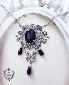 Beautiful silver ornaments decorated with purple gem Ornate Silver Baroque Necklaces, Purple Necklaces With Intricate Design For Wedding, Purple Wedding Necklaces With Intricate Design, Purple Wedding Necklace With Intricate Design, Gothic Sterling Silver Jewelry With Intricate Design, Purple Filigree Pendant Necklace, Purple Pendant Necklace With Filigree, Purple Necklaces With Intricate Design For Gift, Elegant Purple Metal Necklace