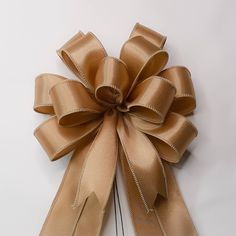 a large gold bow on a white background