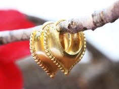 "Ornamented solid yellow gold hoop earrings. Our Rustic Gold Hoop Earrings are a special take on ornamental jewelry! These oriental-style hoops feature a scalloped, beaded edge and an Eastern-themed teardrop shape. These earrings are elaborate and delicate but still very noticeable. They have a very eye-catching rustic look that will elevate any outfit. Because they are made-to-order, your recipient can rest assured that they'll be the only ones wearing these gorgeous hoop earrings! This is a gr Unique Gold Earrings, Gold Earrings Indian, Creole Earrings, Beaded Edge, Alternative Jewelry, Earrings Indian, Vintage Style Earrings, Indian Jewelry Sets, Earrings Antique