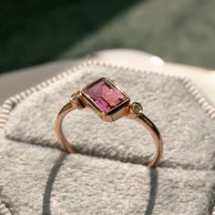 Gauzy Pink Tourmaline Ring | ChicVida Fine Jewelry Pink Amethyst Ring In 14k Gold For Anniversary, Pink Amethyst 14k Gold Ring For Anniversary, Pink Sapphire Ring In 14k Rose Gold As Gift, Pink Gemstone Rings In 14k Rose Gold, Formal Pink Sapphire Ring With Bezel Setting, Fine Jewelry Pink Ring With Bezel Setting, Pink 14k Gold Amethyst Ring, Rose Gold Emerald Cut Sapphire Ring In 14k Gold, Rose Gold Ruby Tourmaline Ring