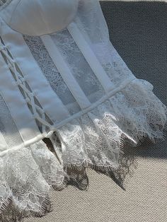 The branches, leaves and flowers are adjusted and modified with some traditional patterns, and the wiring is fresh and elegant. The unique three-dimensional texture of the embroidery matches the complex beauty of the lace, adding details to the overall skirt. 
 The embellishment of lace brings out the proportions of the lower body, and it will not feel monotonous because of the solid color and embroidery. The hazy and transparent texture of the skirt maximizes the beauty of wanting to resist and Fitted Lace Dress With Lace Work, Fitted Bodice Lace Dress, Feminine Lace Corset With Lace Trim, Elegant Lace Corset, Elegant Cotton Lace Top, Feminine Lace Corset With Lace Bodice, Feminine Lace Bodice Corset, Fitted Lace Corset For Wedding Night, Elegant Lace Corset For Wedding Night