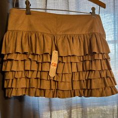 Gianni Bini Nwt Ruffled Mini Skirt (Juniors) Fall Ruffled Tiered Skort, Fitted Brown Bottoms With Ruffles, Brown Tiered Ruffle Skirt, Brown Ruffled Tiered Mini Skirt, Spring Brown Skirt With Ruffles, Spring Brown Ruffled Skirt, Brown Ruffled Mini Skirt, Brown Ruffled Skirt, Tan Mini Skirt