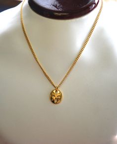 "This beautiful Gold toned vintage necklace hangs from a 16\" vintage chain. It is 5/8\" x 9/16\". dating back to the 60's, early 70s. Never before worn. Larger quantities also available. Please convo with any questions." Retro Gold Necklaces With Vintage Charm, Retro Gold Necklace With Vintage Charm, Vintage Oval Necklace With Adjustable Chain, Retro Oval Necklace For Gift, Vintage Chain Necklace With Round Pendant, Vintage Brass Medallion Necklace With Adjustable Chain, Vintage Medallion Necklace Gift, Vintage Pendant Necklace With Delicate Chain, Vintage Gold Oval Chain Necklace