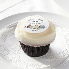 a cupcake on a white plate with a label that says jesus through the sea