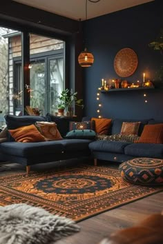 a living room filled with lots of furniture next to a large glass window and a rug on the floor