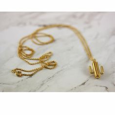 This cool cactus necklace is perfect for everyday wear, with its tactile 3D design and a touch of Art Deco elegance, looks great on its own or layered with other chains.The Cactus is the ultimate symbol of protection and strength, surviving and flourishing in dessert conditions. In Arabic they're called 'Sabbar' - which also means a person of endurance and patience.Handmade in London from 100% recycled silver, which is then heavily overlayed with 18ct Gold, and comes beautifully packaged in a Le Cool Cactus, Large Cactus, Cactus Necklace, In Arabic, Recycled Silver, Recycled Sterling Silver, White Sapphire, Independent Designers Fashion, 3d Design