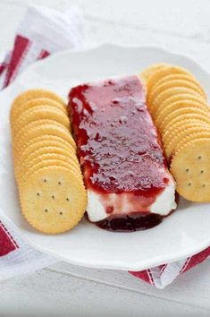 a plate with crackers and jelly on it