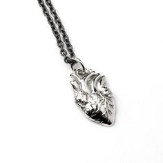 A unique design of charm necklace, brilliantly crafted out of sterling silver. This anatomical heart shaped pendant has an intricate details forming a marvellous super realistic piece of jewelry. Material: Sterling silver Dimensions: 21mm by 10mm Comes on a silver chain Click here to see the matching ring: https://www.etsy.com/uk/listing/959312135/sterling-silver-anatomical-heart-ring?ref=shop_home_active_1 All of our jewellery packed in our labeled gift box Let us know if you have any questions Anatomical Jewelry, Medical Pendant, Realistic Heart, Anatomical Heart Necklace, Fake Gauge Earrings, Heart Charm Necklace, Heart Shaped Necklace, Gothic Necklace, Packing Jewelry