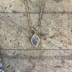 Simple and understated; Fiery labradorite is embedded in brass and anchored on our signature brass chain with a handmade clasp. Beautiful on its own or the perfect layering piece. Pendant Length 5/8" Width 3/8" Chain Length 16" - 18" This piece is handmade-to-order, please allow 1 - 2 weeks to ship unless this piece is in stock. Each piece will vary slightly due to the uniqueness of the stones. All metal is nickel free. Gold Labradorite Everyday Jewelry, Everyday Gold Labradorite Jewelry, Gold Hammered Moonstone Jewelry, Hand Forged Moonstone Gold Jewelry, Hand Forged Gold Moonstone Jewelry, Artisan Gold Moonstone Necklaces, Gold Hand Forged Moonstone Jewelry, Artisan Gold Moonstone Necklace, Gold Necklace With Raw Stone For Everyday