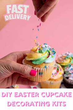 a cupcake being dunked with sprinkles by someone's hand