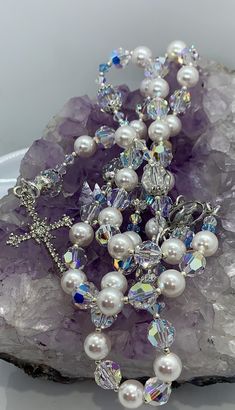 High quality and beautifully unique Catholic Rosary beads made with Swarovski crystals. Perfect for Christenings/Baptisms, wedding gifts/favours, Holy Communions and every other occasion. This beautiful Rosary is made using top quality materials. Silver 49 strand wire-for added strength and durability, exquisite silver and zircon crucifix approximately 4cm x 2.5cm L/W. Lovely silver miraculous medal, delicate and aesthetically pleasing French wire, Miyuki seed beads, silver and sterling silver e White Pearl Jewelry With Sparkling Stones, White 8mm Beads Jewelry For Anniversary, Gift Jewelry With 8mm Crystal Beads, Elegant Pearl Jewelry For Baptism, White Sparkling Pearl Jewelry, Elegant Pearl White Jewelry For Baptism, Elegant Pearl White Jewelry For First Communion, Spiritual White Crystal Jewelry, Elegant Beaded Crystals For Gifts