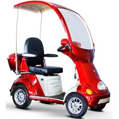 a red scooter with a canopy attached to the back and seat on white background