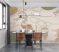 a dining room table and chairs in front of a wall with coffee designs on it