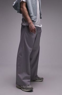 Go for a relaxed fit with your next smart-casual look in these baggy pants cut from a crisp cotton with a hint of stretch. 32" inseam; 20" leg opening; 13" front rise; 16" back rise (size 32) Back elastic waist Side-seam pockets 98% cotton, 2% elastane Machine wash, line dry Imported Elevated Casual Cotton Wide Leg Pants With Pockets, Cotton Wide Leg Pants With Pockets For Casual Wear, Relaxed Fit Wide Leg Cotton Pants, Relaxed Fit Full Length Wide Leg Cotton Pants, Cotton Wide Leg Full Length Pants In Relaxed Fit, Cotton Wide Leg Full Length Pants, Everyday Cotton Wide Leg Pants For Fall, Modern Wide-leg Dress Pants With Pockets, Urban Cotton Bottoms With Welt Pockets