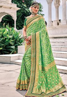 Light green silk patola print saree 5810  Desc:  Color : Light Green Fabric : Silk Work : Embroidery Wash Care : Dry clean Sleeve Style : Half Sleeve Long Sleeves : Done only in Custom Stitch Sleeves Lining : Done only in Custom Stitch Bust Size : 32 to 42 Inches Occasion : Festival   Christmas   Diwali   Ceremonial   Baby Shower   Pongal   Lohri   Gudi Padwa   Onam   Raksha Bandhan. With Express Free Shipping and Custom Stitching, Buy Indian Wedding Party Wear Saree Light green silk patola prin Green Pre-draped Saree With Meenakari For Puja, Green Semi-stitched Pre-draped Saree With Meenakari, Green Bollywood Pre-draped Saree With Meenakari, Green Traditional Wear With Bandhani Print For Festive, Green Dola Silk Saree For Puja, Green Meenakari Banarasi Silk Pre-draped Saree, Green Saree With Meenakari In Traditional Drape, Green Dola Silk Saree For Festivals, Green Dola Silk Saree For Navratri