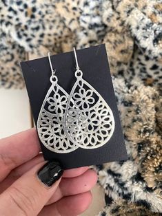 These large brushed silver plated filigree flower teardrop dangle earrings are finished with your choice of sterling silver balled ear wires or lever backs.  Boho chic earrings that are perfect for everyday. They measure approximately 2.25" from end to end. You may also like to check out more of my filigree jewelry here: https://etsy.me/2Tk8TYE You may also like to check out more of my earrings here: http://etsy.me/2oDJlWy Free first class USPS shipping within the USA. Silver Teardrop Earrings With Flower Charm, Teardrop Earrings With Flower Charm, Silver Teardrop Flower Earrings With Flower Charm, Silver Drop Earrings With Flower Charm, Silver Teardrop Flower Earrings In Sterling Silver, Filigree Flower Drop Earrings, Elegant Teardrop Metal Flower Earrings, Silver Teardrop Flower Earrings, Metal Teardrop Filigree Earrings