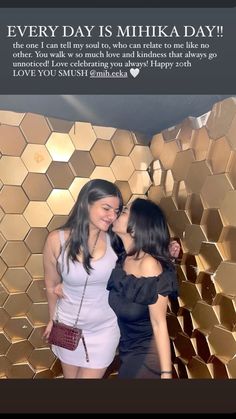 two women standing next to each other in front of a gold wall with the words every day is mikika day