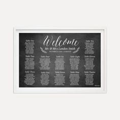 a black and white chalkboard wedding seating chart with the names of guests in cursive font