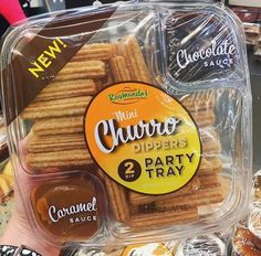 a package of mini churros is on display in a store window for sale