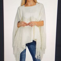 Women’s Soft Poncho With Fringe Cream 100% Acrylic One Size Chic White Winter Cape, Elegant White Poncho For Winter, Elegant White Winter Poncho, White Shawl Poncho For Spring, Chic White Cape For Fall, White Shawl Poncho For Fall, White One Size Shawl Poncho, Casual White Poncho Shawl, Casual White Poncho With Batwing Sleeves