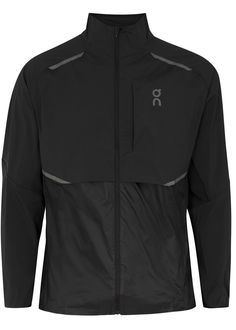 a black jacket with grey details on the chest and zippers at the front,