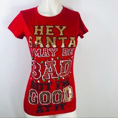 This Christmas Lettering T-Shirt Is Perfect For The Holidays. Pit To Pit: 17” Length: 24” Condition: Nwt 1/059 Christmas Cotton T-shirt With Text Print, Red Short Sleeve Holiday Top, Red Short Sleeve Top For Holidays, Red Festive Holiday Top, Red Holiday Tops For Festive Occasion, Festive Crew Neck T-shirt With Letter Print, Festive Letter Print Crew Neck T-shirt, Red Graphic Print T-shirt For New Year, Festive Holiday Letter Print T-shirt