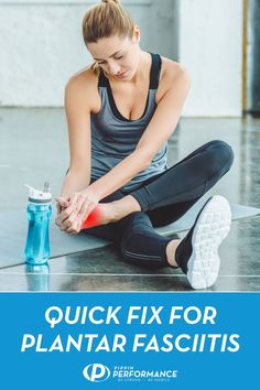 a woman sitting on the ground with her hand in her pocket and holding a water bottle