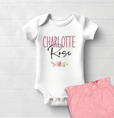 Our line of Name/Personalized Onesie® bodysuits comes in many designs,  for baby girls, boys, as well as gender neutral designs.  Whether it is a delicate floral design surrounding your baby's name,  bright primary colors, or pastel nursery theme animals incorporating baby's name,  these make the perfect gift for newborns or toddlers.  Be sure to leave first and middle name in the personalization drop down. All of the baby bodysuits that we offer are designed and printed using professional equip Pink Onesie With Letter Print For First Birthday, Pink Short Sleeve Bodysuit, Pink Letter Print Onesie For Summer, Summer Pink Onesie With Letter Print, Cute Pink Onesie With Name Print, Fitted Pink Onesie With Letter Print, Pink Cotton Onesie With Name Print, Pink Cotton Onesie For Gift, Fitted Bodysuit With Name Print For First Birthday