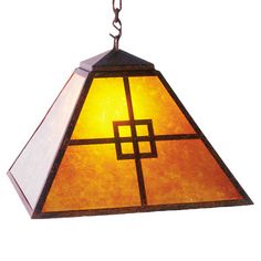 a light hanging from a chain with a cross on the bottom and an orange glass shade