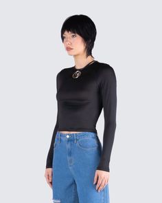 Your new fav everyday staple 🖤 Made from stretch jersey fabric, and complete with long sleeves, and a bodycon fit - this black top is a NEED for all our baddies. Sleek, simple, and sexy... what more could you want 😏 Solid Color Club Tops In Elastane, Trendy Stretch Long Sleeve Top, Trendy Stretch Long Sleeve Top In Elastane, Trendy Stretch Elastane Long Sleeve Top, Sleek Black Bodycon Tops, Night Out Tops With Minimal Stretch Elastane, Night Out Tops With Minimal Stretch, Trendy Bodycon Long Sleeve Tops, Sleek Stretch Tops For Club