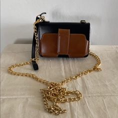 Nwt Case-Mate Leather Gold Chain Bag Or Wristlet I Had This For A Couple Of Years And Never Used It. It’s A Small Wallet W/ A Detachable Gold Chain. Has A Snap Closure On The Outside That Was Made For A Smaller Phone. The Inside Has An Id Slip Pocket W/ 2 Credit Card Pockets. A Snap Coin Pocket As Well As 2 Slip Pockets Inside. Also, 1 Slip Pocket On The Outside. It Can Also Be Used As A Wristlet. Zipper Opening. Comes With Dust Bag. Approximate Measurements 3.5 X 5.2” Chain Drop 26” Brown Square Box Bag With Gold-tone Hardware, Brown Rectangular Box Bag With Gold-tone Hardware, Black Square Wallet For Daily Use, Square Box Bag With Metal Hardware For Everyday Use, Brown Square Bag With Chain Strap, Everyday Pouch Clutch With Chain Strap, Versatile Brown Box Bag With Detachable Strap, Evening Bags With Metal Hardware In Brown, Leather Wallet On Chain With Metal Hardware