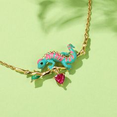 Chameleons change their skin color partly as a response to emotions and moods, revealing excitement, anger, contentment and more in vibrant shades and mesmerizing patterns. This hand-painted enamel chameleon is beautifully detailed, making it the perfect accessory for anyone who wants to add a touch of color to their wardrobe. This necklace is versatile and can be worn casually or dressed up for a special occasion. It's a perfect gift for anyone who loves chameleons, miniature collectibles, or a Dinosaur Necklace, Jewelry Accessories Ideas, Carrie Bradshaw, Funky Jewelry, Jewelry Lookbook, Mixed Metals, Cute Jewelry, Sterling Silver Necklaces, Jewelry Accessories