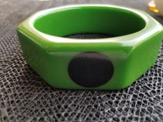 "This is a Wonderful Bakelite bracelet. green with black polka dot's Measures 1\" wide inside 2 1/2\" condition is vey good tested Bakelite" Modern Green Cuff Bangle Bracelet, Retro Green Bangle Bracelets, Retro Green Bracelet For Gift, Retro Green Bracelet Gift, Retro Green Bracelets For Gifts, Retro Green Bracelets For Gift, Green Retro Bracelet As A Gift, Bakelite Bracelets, Bakelite Bangles