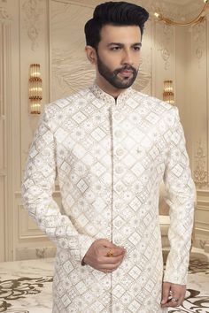 This sherwani is perfect for grooms and guests alike, featuring intricate thread and sequin work. Look dashing and stand out at any event. Add a touch of elegance to your ensemble with our R14-S55 mens sherwani. Designer Off White Wedding Sets, Designer Fitted White Traditional Wear, Designer White Fitted Traditional Wear, White Sherwani With Resham Embroidery And Long Sleeves, White Bandhgala With Dabka Work For Festive Occasions, Designer Off White Sherwani For Wedding, White Bandhgala With Intricate Embroidery For Festive Occasions, White Set With Dabka Work For Formal Occasions, Festive White Bandhgala With Intricate Embroidery