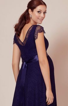 A fun and flirty take on our floor sweeping gown by the same name, our Kristin maternity dress has the same A-list glamour, romantic sweetheart neckline and exquisite eyelash lace from head to toe. •Deep indigo blue eyelash lace •Vintage-feel with satin-edged sweetheart neckline •Scalloped eyelash edge cap sleeve •Subtle stretch to grow with you •Baby-soft premium jersey lining •Pretty sheer cap sleeve and neckline •Flattering swishy knee length skirt •Lovingly designed and made in Britain Elegant Blue Maternity Gown, Elegant Maternity Dress With Sweetheart Neckline, Maternity Dresses With Sweep Train, Blue Empire Waist Dress With Lace Trim, Elegant Maternity Dress With Lace Trim, Elegant Maternity Wedding Dress With Lace Trim, Elegant Wedding Maternity Dress With Lace Trim, Elegant Maternity Dresses With Scalloped Lace, Elegant Maternity Lace Dress With Lace Trim