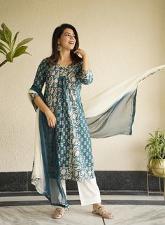 This beautiful  Handblock Kurta suit  set with Dupatta is the most comfortable and classy Indian outfit. Soothing cotton fabric in this Jaipuri block print makes it very elegant. The pants a comfort fit with elastic band that makes the pants roomy. 3/4th sleeves and stylish v neck pleated kurta make it comfortable to wear for long hours , can be accessorised and worn at occasions . Specially handmade with love for you by the local Artisans of Jaipur , Rajasthan , India !  Size chart in pictures  Model is wearing size M size chart in pics  set includes 1 kurta with pants and Dupatta . Suit Set Women, Jaipuri Print, Kurta Set With Dupatta, Indian Salwar, Print Block, Indian Salwar Kameez, Long Kurti Designs, Kurta With Pants, Indian Outfit