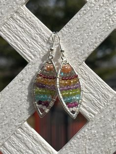 These lovely and unique earrings are made with silver plated framing and are wire wrapped with silver plated wire. The gemstone beads used for these earrings include the following: 3.5mm peach moonstone, 3mm labradorite, 2mm garnet, 3mm citrine, 3mm amethyst, 3mm peridot, 3.5mm blue apatite, 2.5mm ruby, and 2mm rainbow moonstone! They hang on sterling silver ear wires.  These earrings measure approximately 1.5-0" long from the ear wire down. Please view the photo of them next to a quarter for si Bohemian Silver-plated Drop Earrings, Bohemian Silver Plated Drop Earrings, Bohemian Silver Plated Wire Earrings For Jewelry Making, Handmade Bohemian Silver-plated Earrings, Handmade Bohemian Silver Plated Earrings, Bohemian Nickel-free Silver-plated Wire Earrings, Bohemian Silver Crystal Earrings With Gemstones, Bohemian Sterling Silver Beaded Earrings Wire Wrapped, Bohemian Rainbow Wire Wrapped Earrings